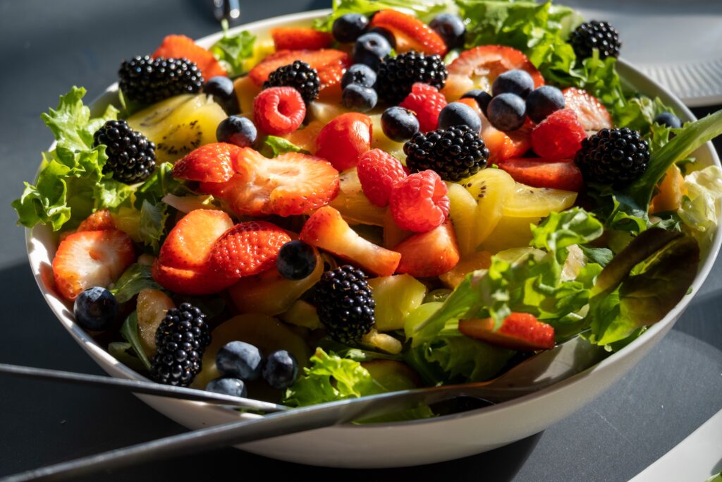 Foods that trigger diverticulitis flares: fruit salad image as a food to avoid in regards to achieving a healthy gut, especially healing diverticulitis Loggins, gut health coach, 40 years, and author, gut health books.
